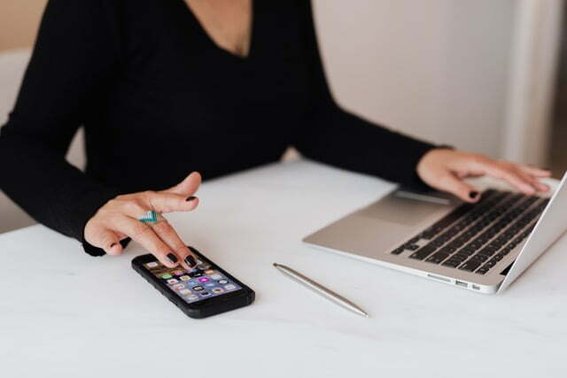 Women on phone and laptop