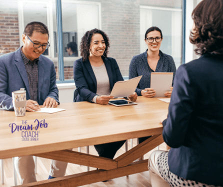 Interview panel of 2 women and 1 man opposite a candidate.