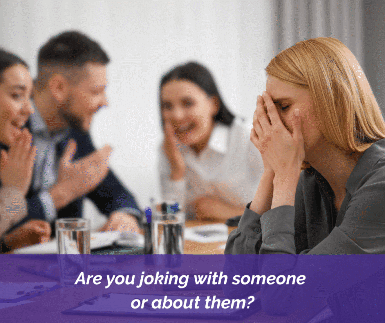 Woman with her hands over her face while colleagues are laughing at her.